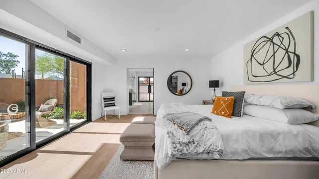 a bedroom with a bed and window