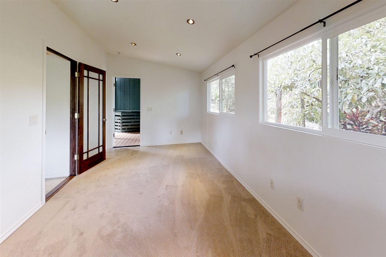911 Kauhikoa Road Haiku, HI 96708 - Photo 13 of 30 an empty room with windows