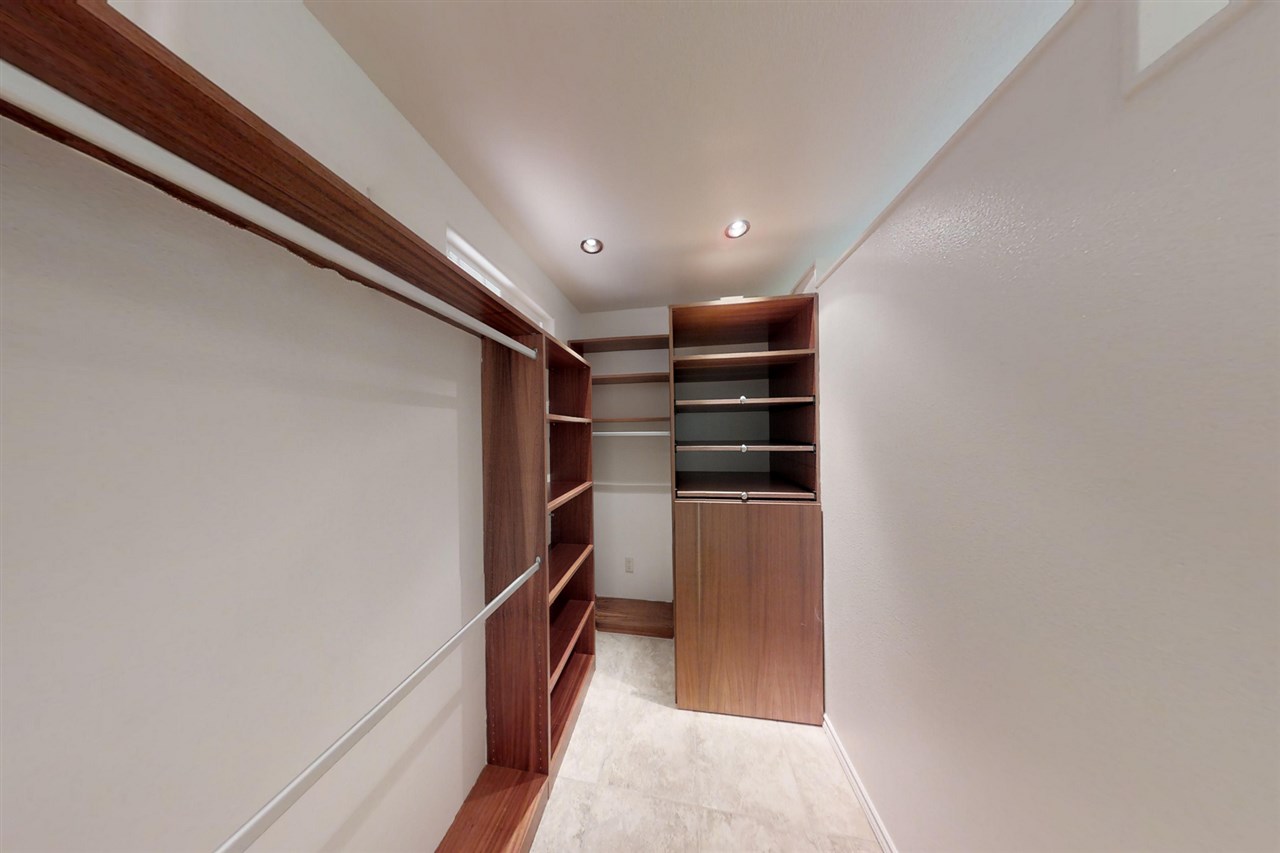 911 Kauhikoa Road Haiku, HI 96708 - Photo 19 of 30 a view of walk in closet with empty racks