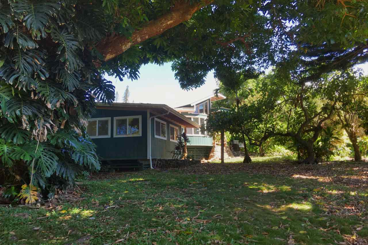 911 Kauhikoa Road Haiku, HI 96708 - Photo 22 of 30 a front view of a house with a yard