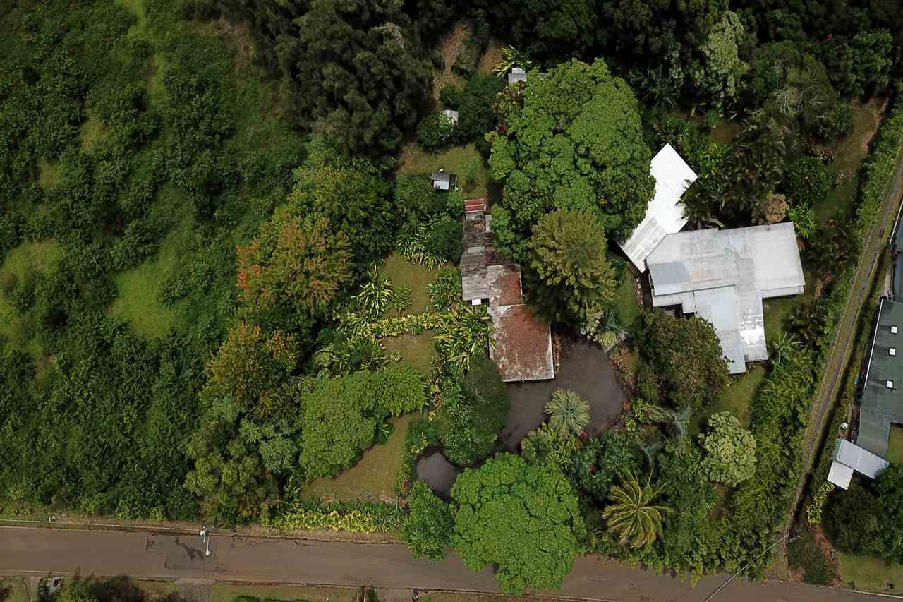 911 Kauhikoa Road Haiku, HI 96708 - Photo 24 of 30 an aerial view of a house with lots of trees
