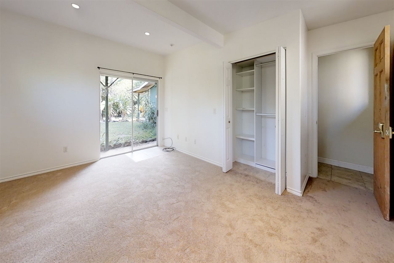 911 Kauhikoa Road Haiku, HI 96708 - Photo 8 of 30 an empty room with windows and closet