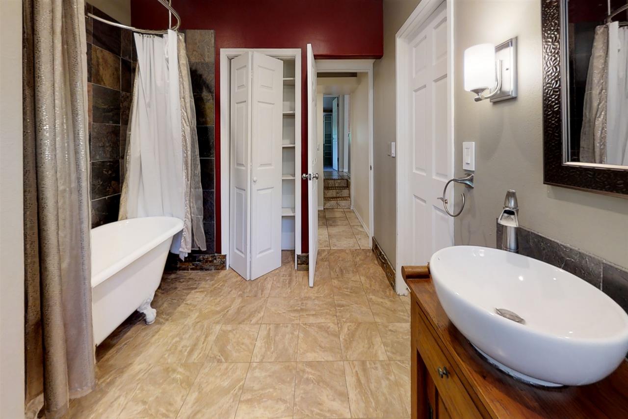 911 Kauhikoa Road Haiku, HI 96708 - Photo 9 of 30 a bathroom with a sink toilet and shower