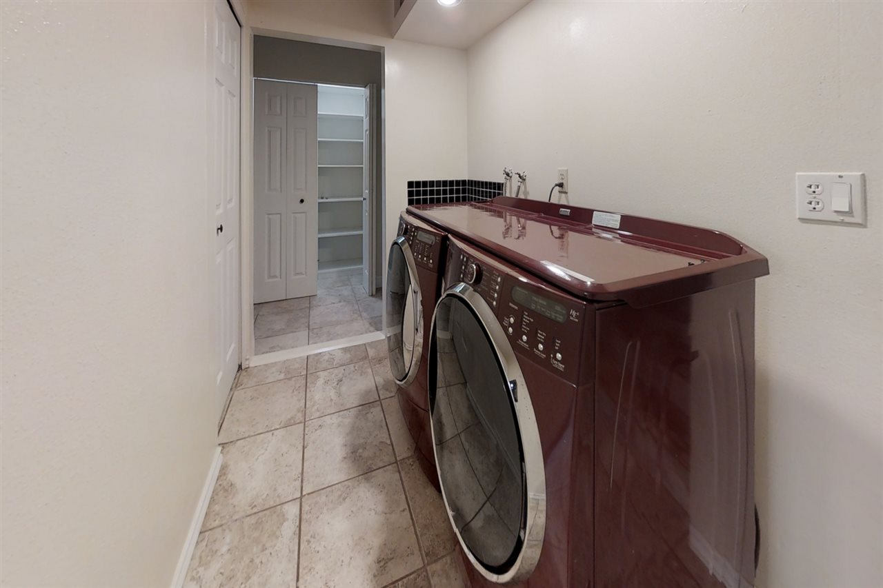 911 Kauhikoa Road Haiku, HI 96708 - Photo 10 of 30 a utility room with dryer and washer