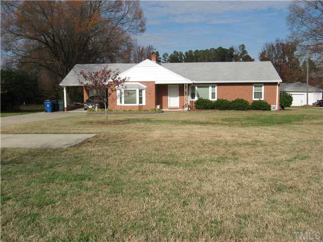 1016 Horton Road Durham, NC 27704 - Photo 2 of 6 a front view of a house with a garden