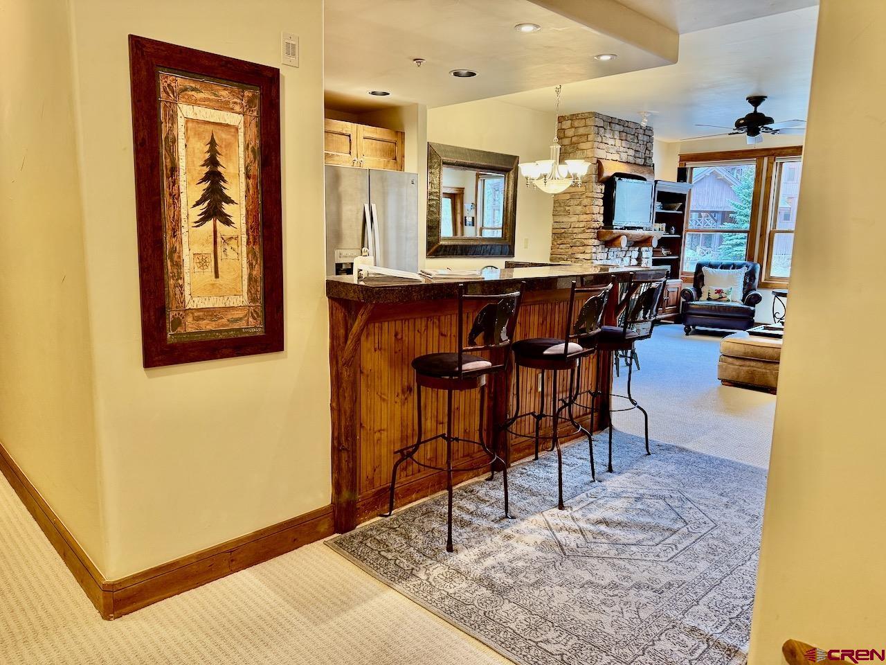9 Hunter Hill Road, Unit 205 Crested Butte, CO 81225 - Photo 4 of 28 a view of a dining room with furniture