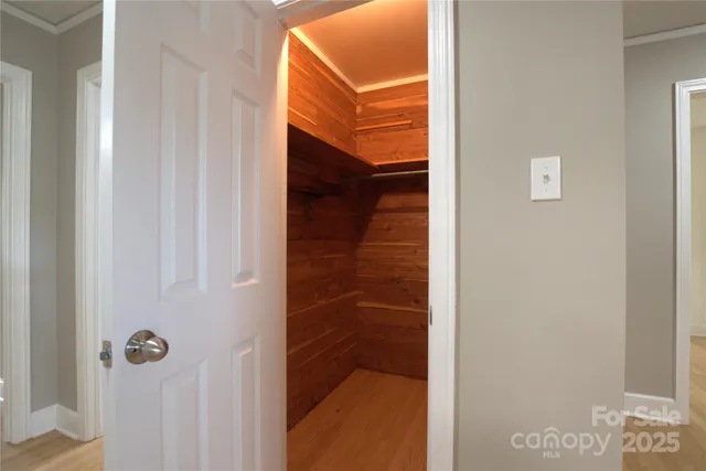 a spacious bedroom with a bed and a window