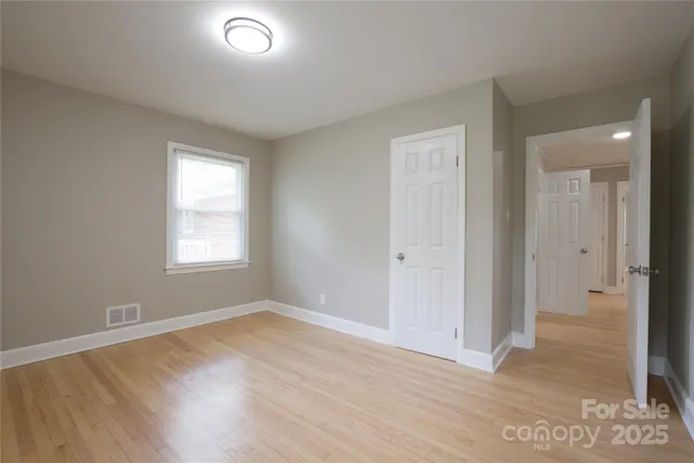 a view of a room with wooden walls
