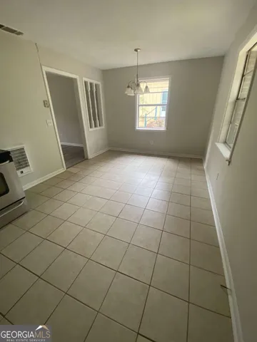 a view of an empty room with windows