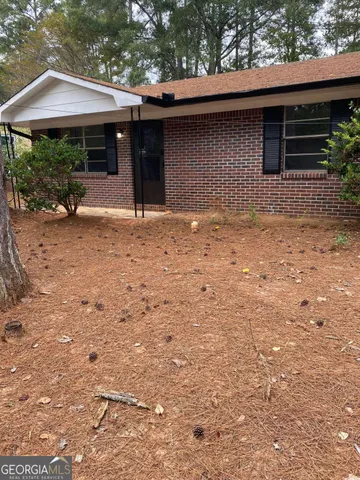 a backyard of a house with yard and garage