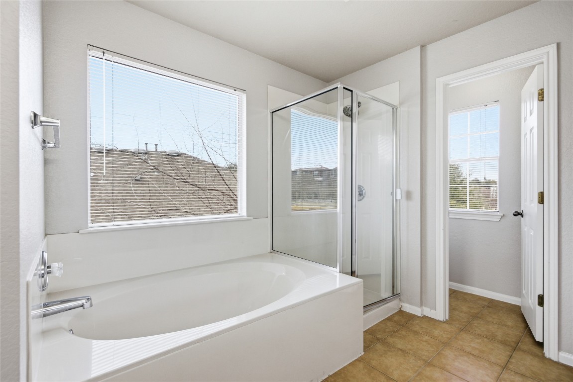 4410 Meadowside Lane Round Rock, TX 78665 - Photo 19 of 22 a white bath tub sitting next to a shower