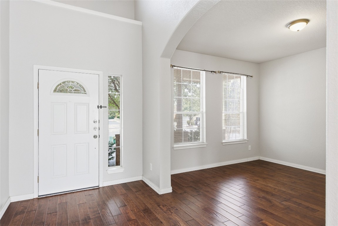 4410 Meadowside Lane Round Rock, TX 78665 - Photo 2 of 22 an empty room with wooden floor and windows