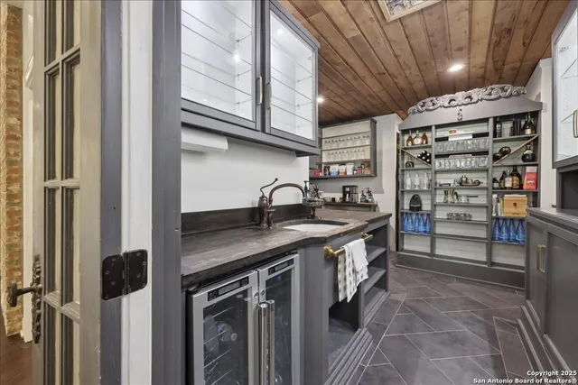 a kitchen with stainless steel appliances granite countertop a sink and cabinets