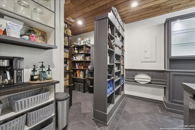 a room with lots of books and a book shelf