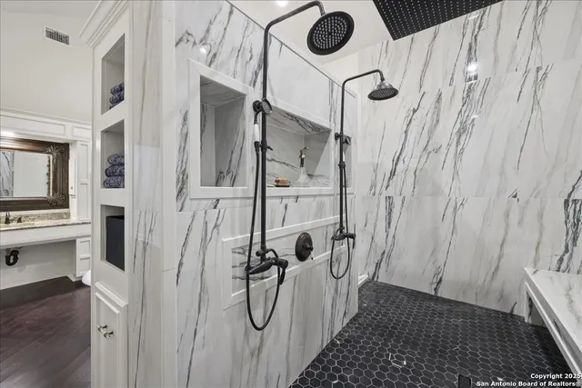 a bathroom with a shower and a sink