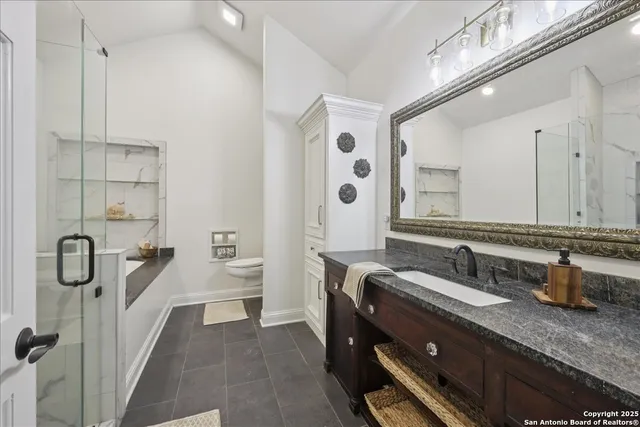 a bathroom with a double vanity sink double mirror and bathtub