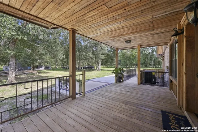 a view of a balcony with wooden floor