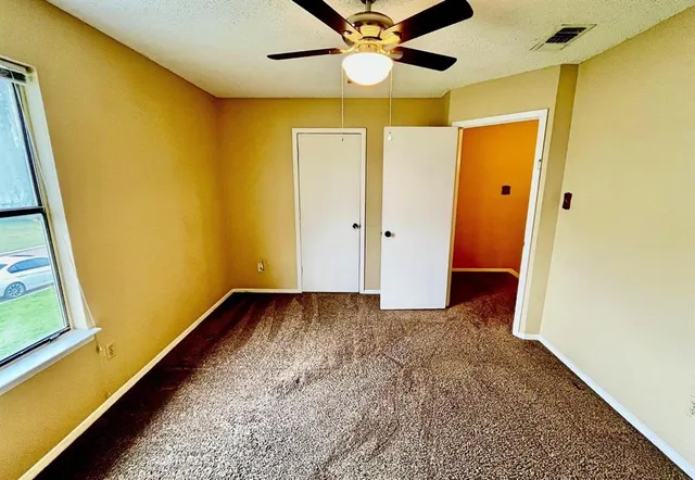 a view of a hallway with a large window