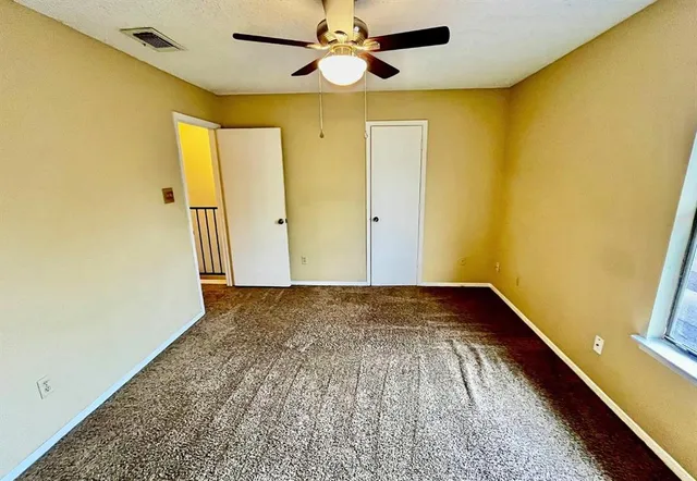 a view of hallway with wooden floor