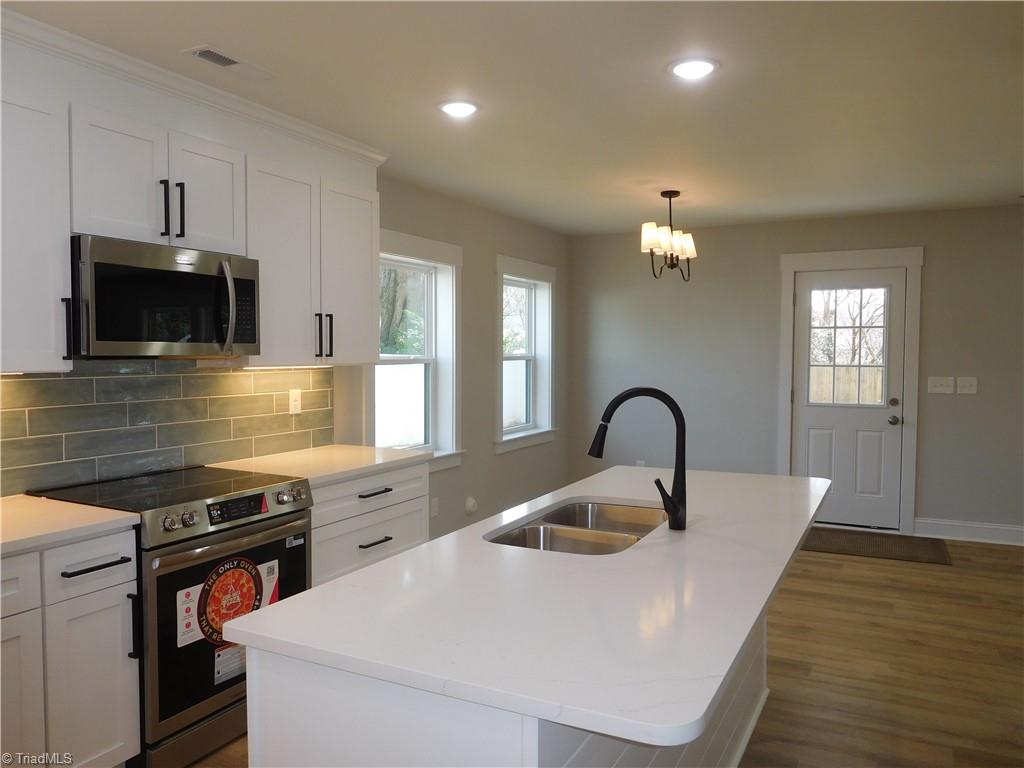 4210 Country Club Road Winston-Salem, NC 27104 - Photo 11 of 41 LOOKING BACK AT THE DINING ROOM.