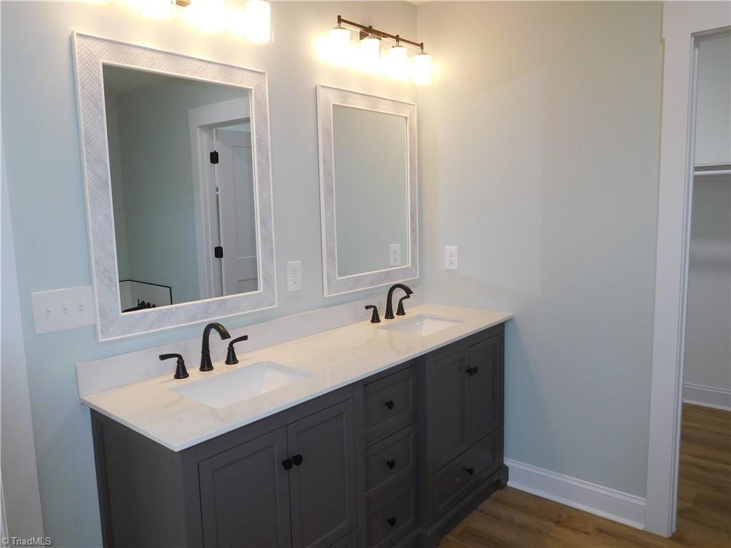 4210 Country Club Road Winston-Salem, NC 27104 - Photo 16 of 41 PRIMARY BATHROOM FEATURES DOUBLE SINK VANITY, SOAKING TUB W/SEPERATE SHOWER, HIDDEN TOILET AND 2 CLOSETS.
