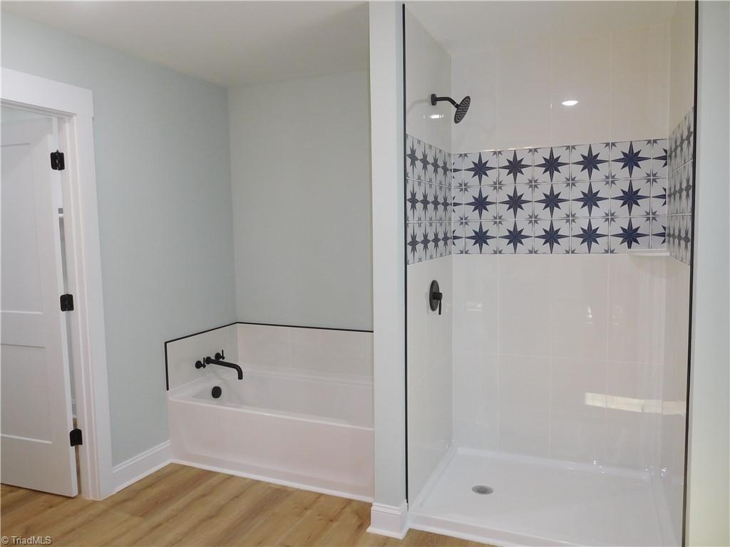 4210 Country Club Road Winston-Salem, NC 27104 - Photo 17 of 41 PRIMARY BATHROOM WITH SOAKING TUB AND SEPARATE WALK-IN SHOWER W/DETAILED TILE.