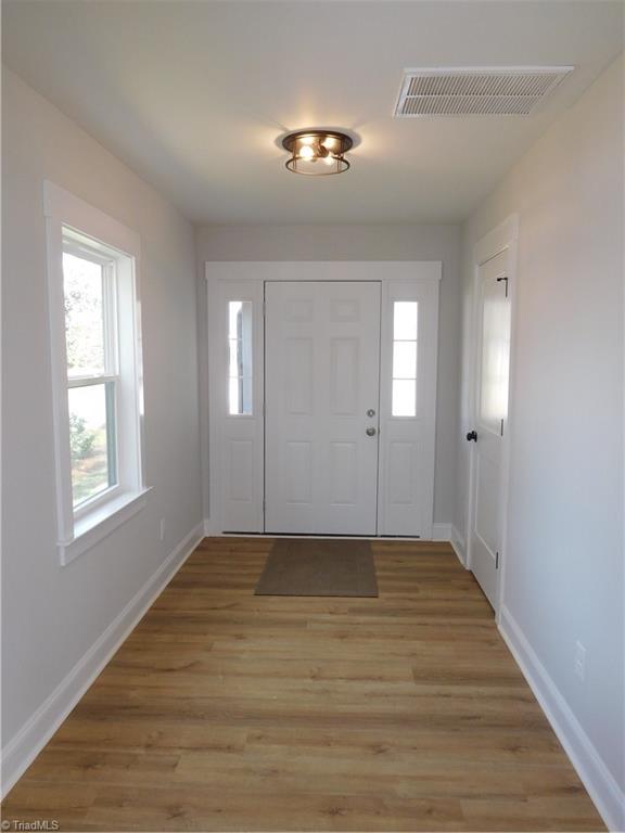 4210 Country Club Road Winston-Salem, NC 27104 - Photo 3 of 41 BEAUTIFUL INVITING ENTRANCEWAY. BEAUTIFUL LIGHT COLORED FLOORS. LARGE COAT CLOSET. THIS HOME HAS TONS OF STORAGE.