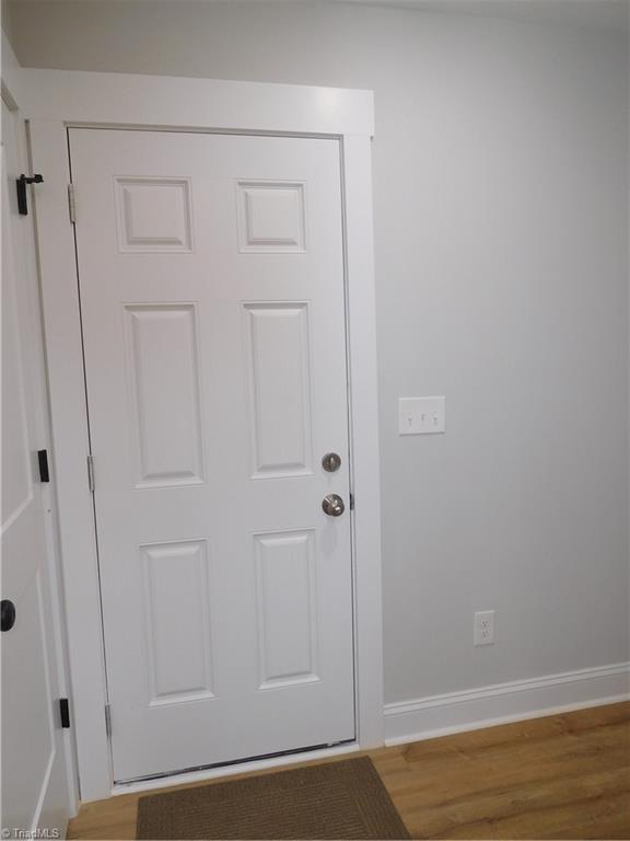 4210 Country Club Road Winston-Salem, NC 27104 - Photo 32 of 41 DROP ZONE AREA OFF GARAGE WITH HALF BATH TO THE RIGHT.