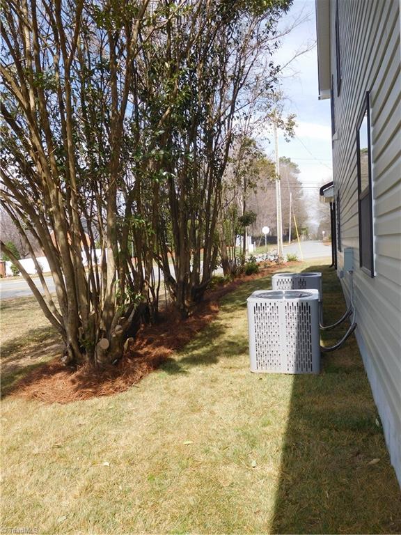 4210 Country Club Road Winston-Salem, NC 27104 - Photo 35 of 41 WHOLE LOT HAS BEEN LANDSCAPED. SIDE OF HOME.