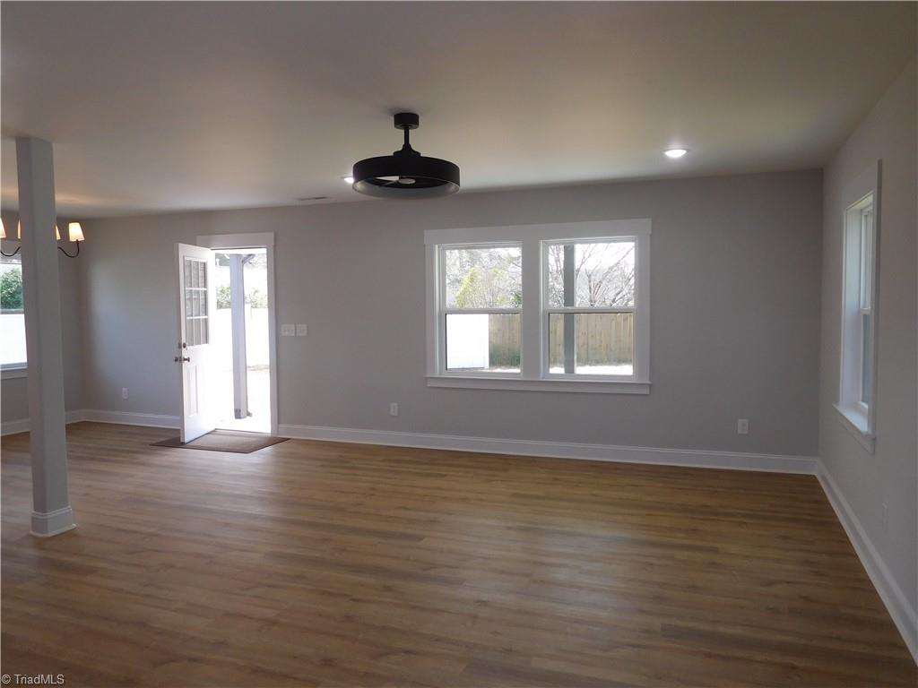 4210 Country Club Road Winston-Salem, NC 27104 - Photo 4 of 41 SPACIOUS LIVING ROOM. DOOR LEADS OUT TO LARGE COVERED BACK PORCH.