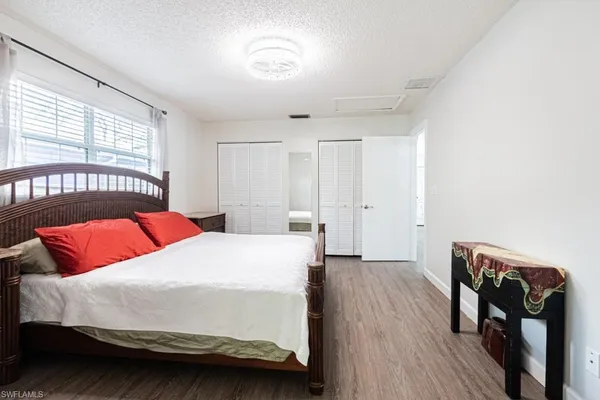 a bedroom with a bed and a table