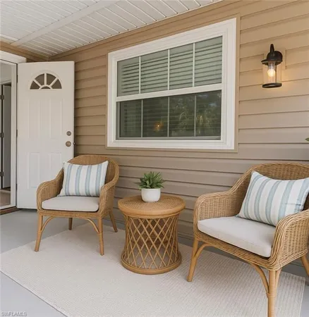 a view of a two chairs in the patio