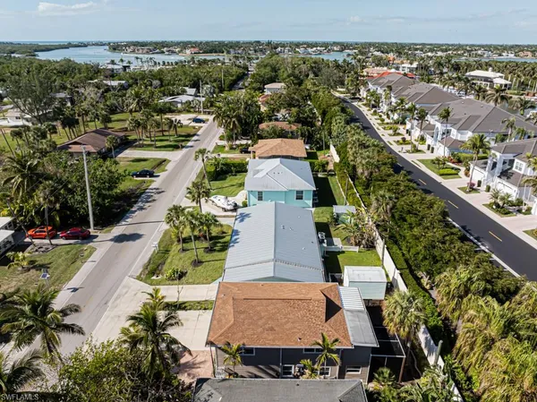 an aerial view of residential houses with outdoor space