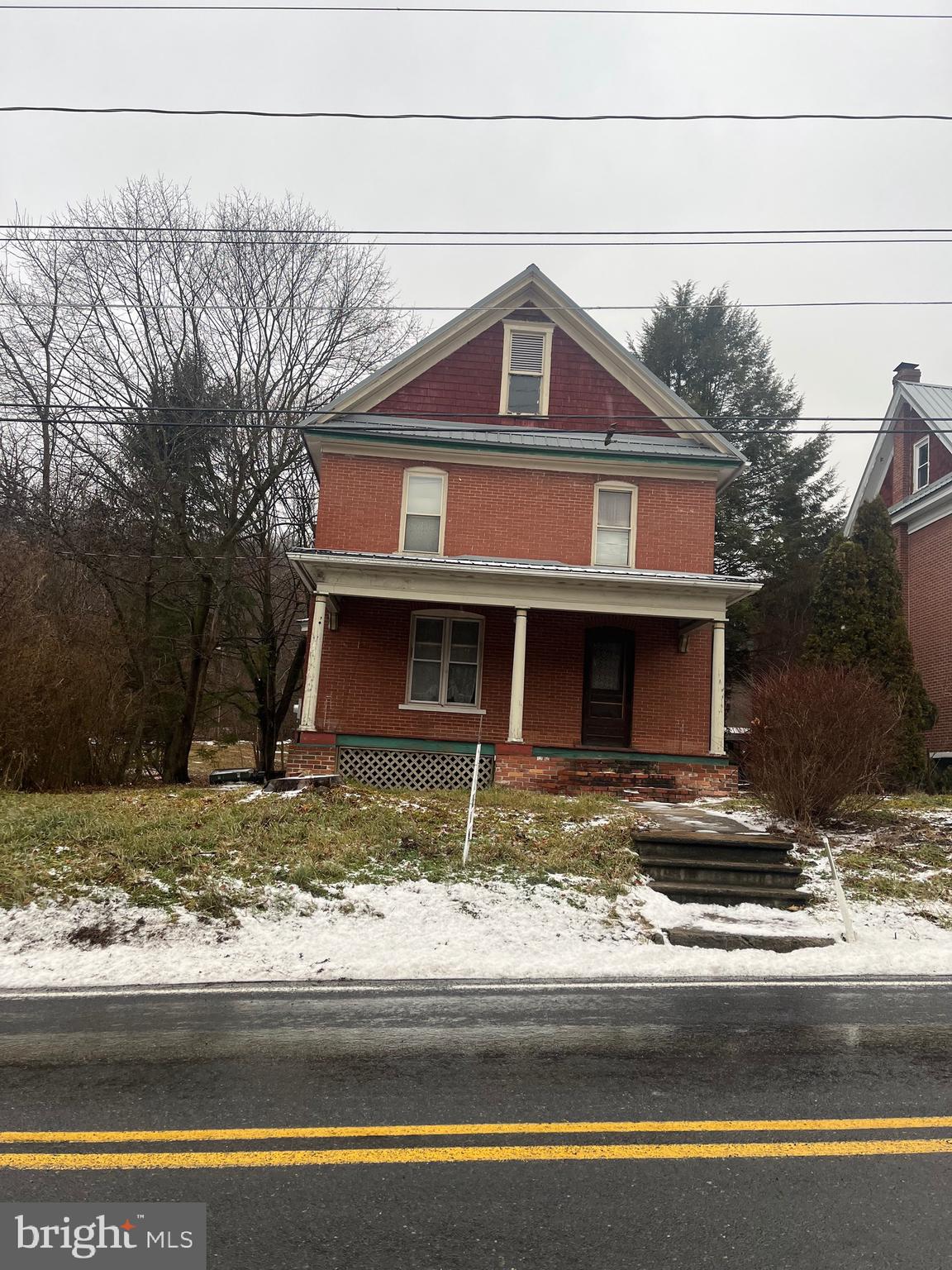 4862 Spruce Creek Road Spruce Creek, PA 16683 - Photo 2 of 13 a front view of a house with a yard