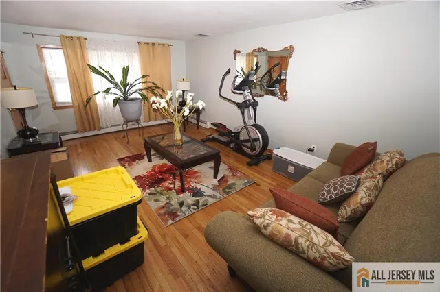 a view of living room with furniture and a window