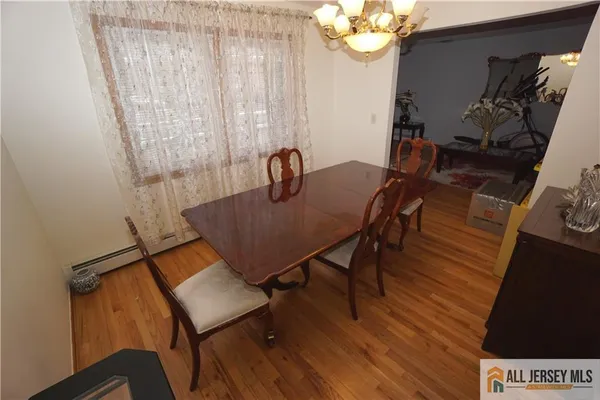 a view of a workspace with furniture and a chandelier