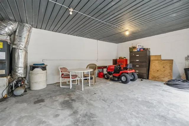 a view of a garage with parked cars
