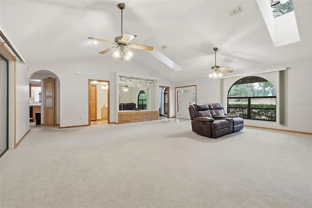 a living room with furniture a chandelier and a chandelier