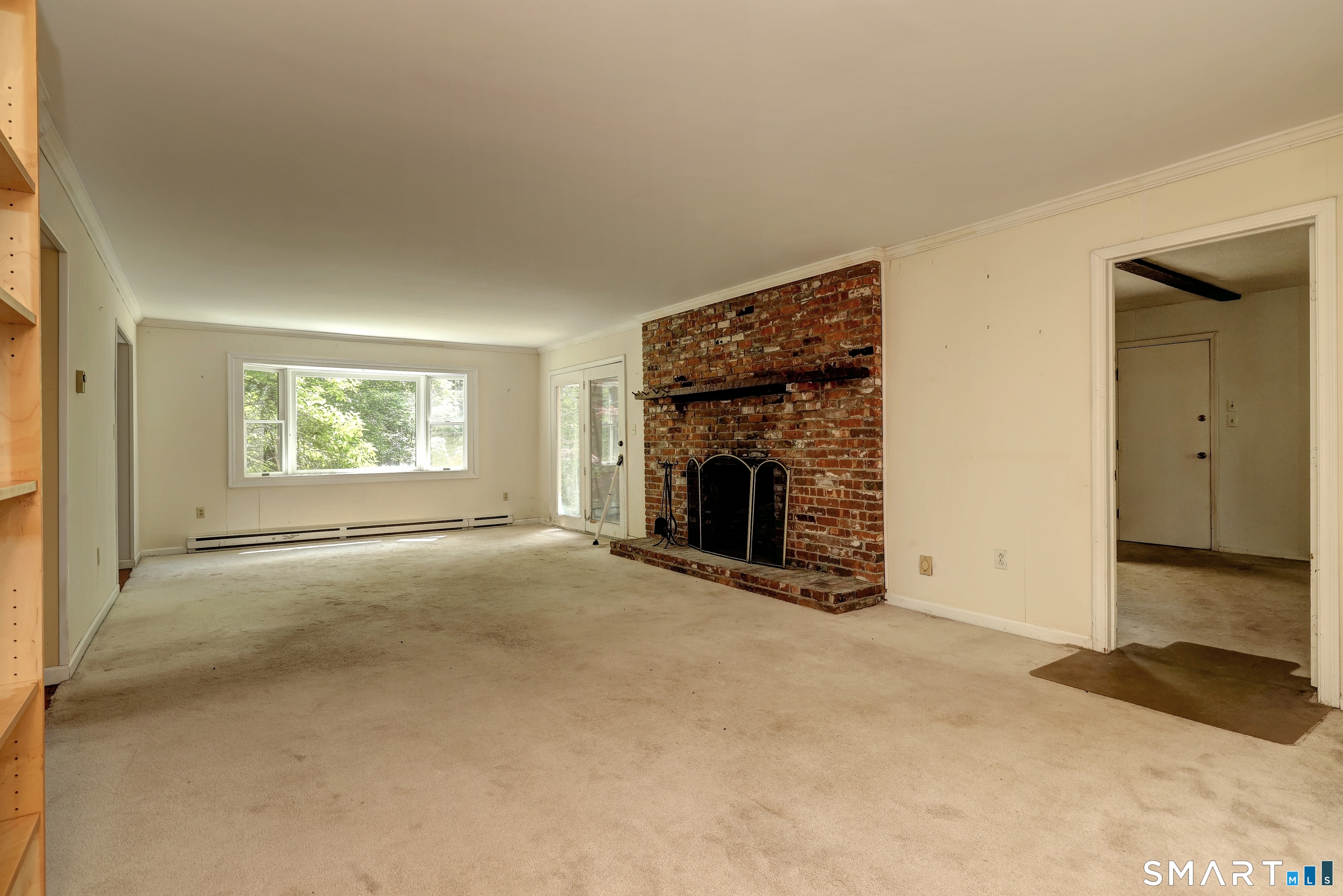 22 East Woods Road Roxbury, CT 06783 - Photo 13 of 37 an empty room with windows and fireplace