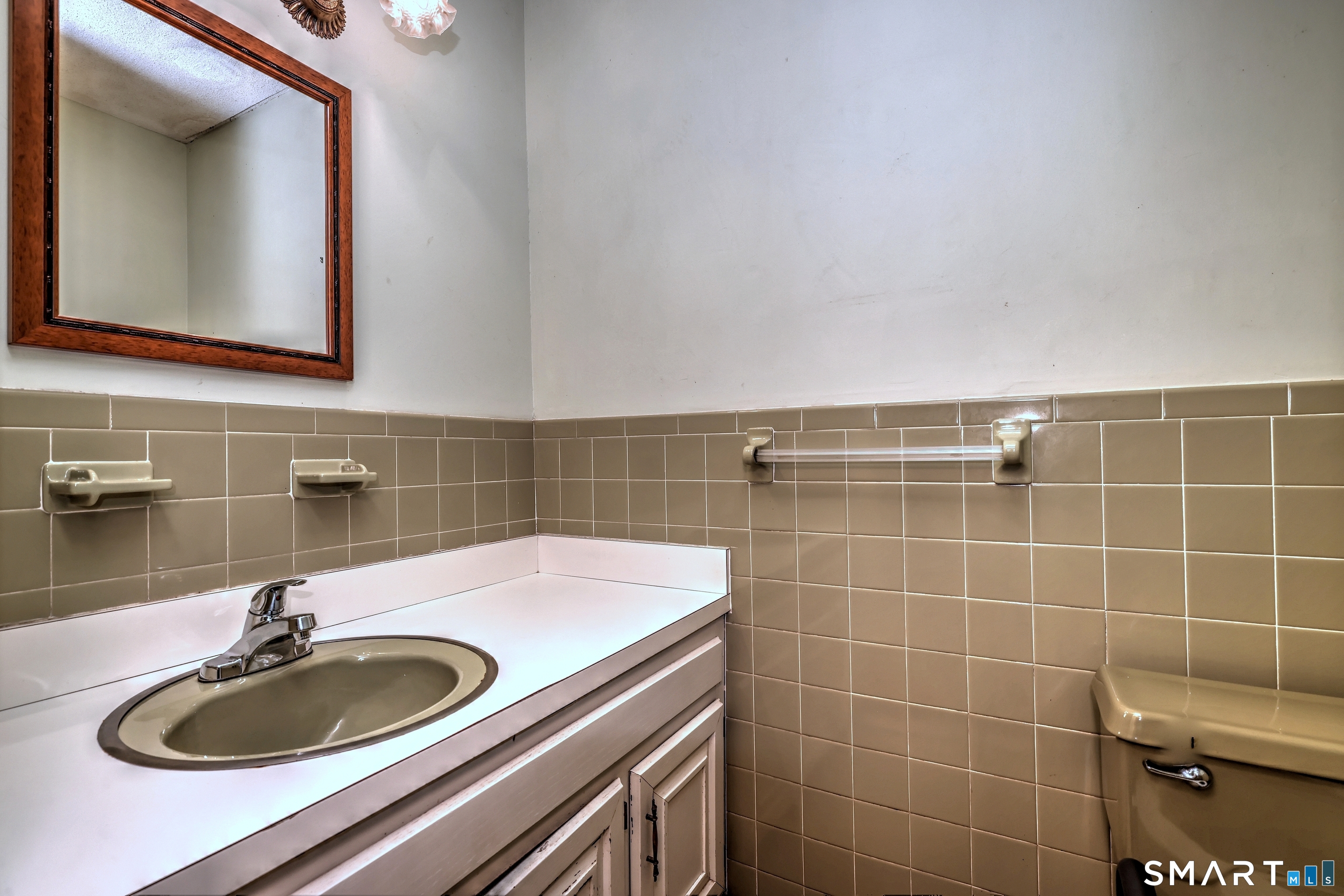 22 East Woods Road Roxbury, CT 06783 - Photo 16 of 37 a bathroom with a sink and a mirror