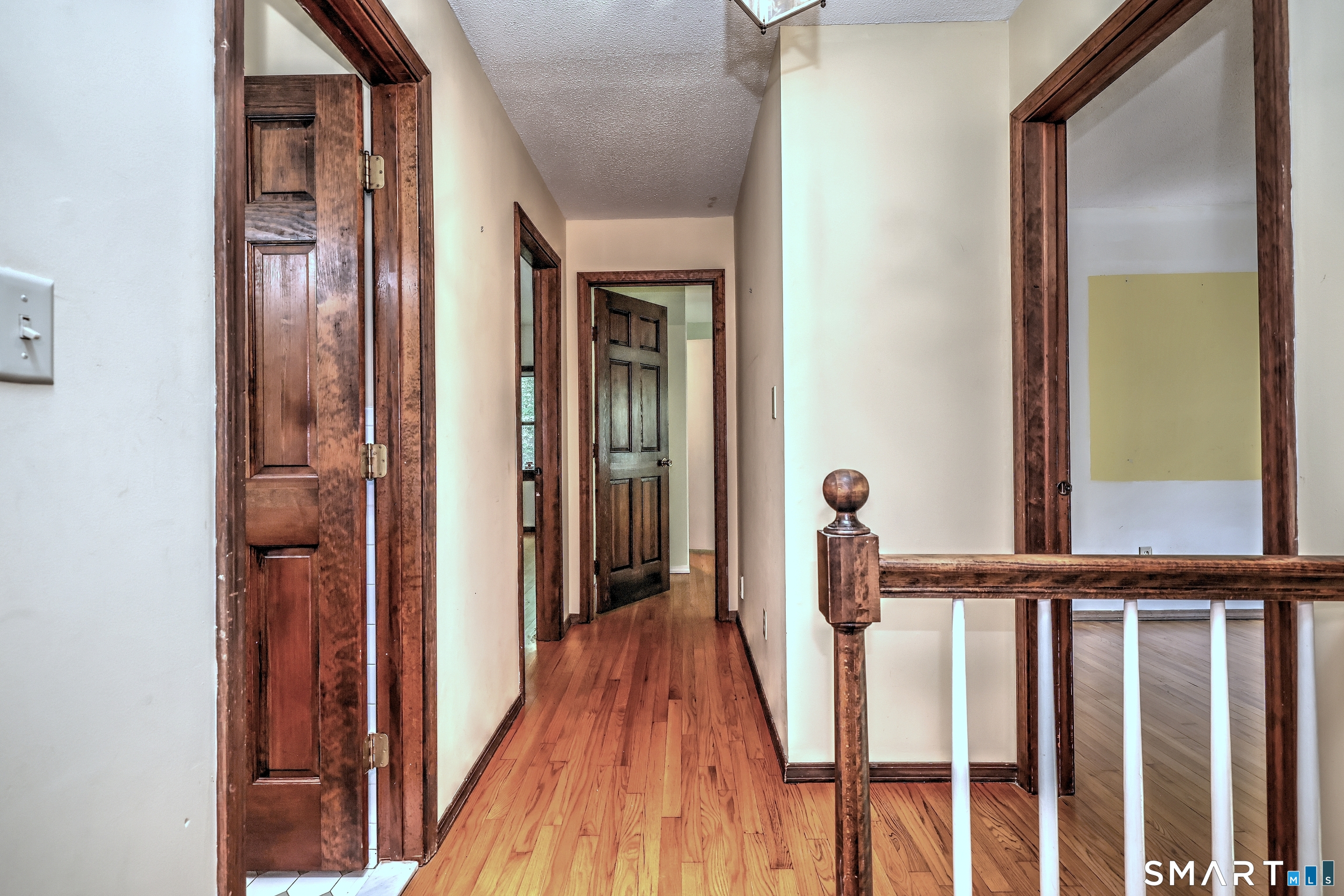 22 East Woods Road Roxbury, CT 06783 - Photo 19 of 37 a view of a hallway with wooden floor and staircase