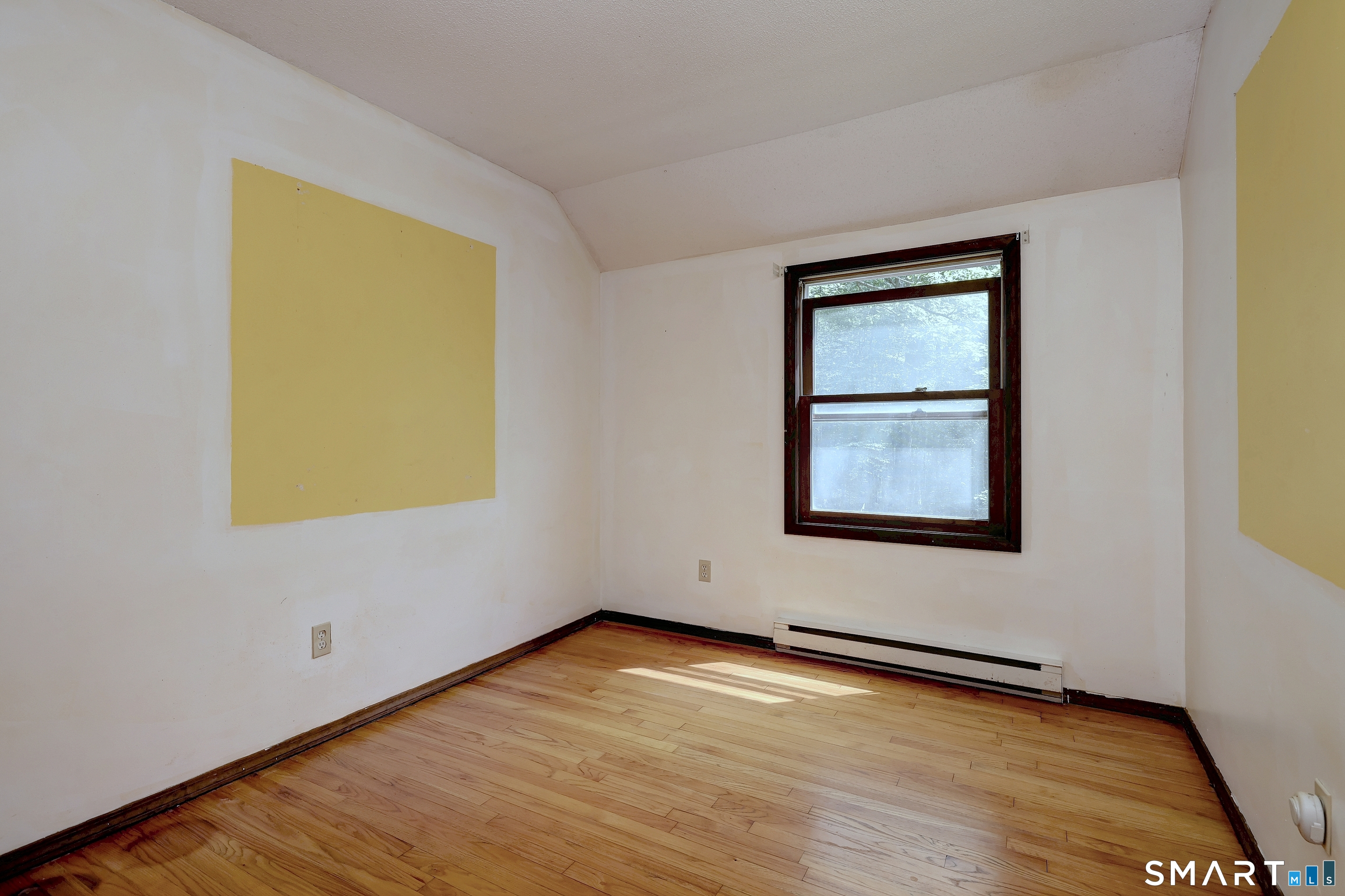 22 East Woods Road Roxbury, CT 06783 - Photo 27 of 37 a view of an empty room with wooden floor and a window