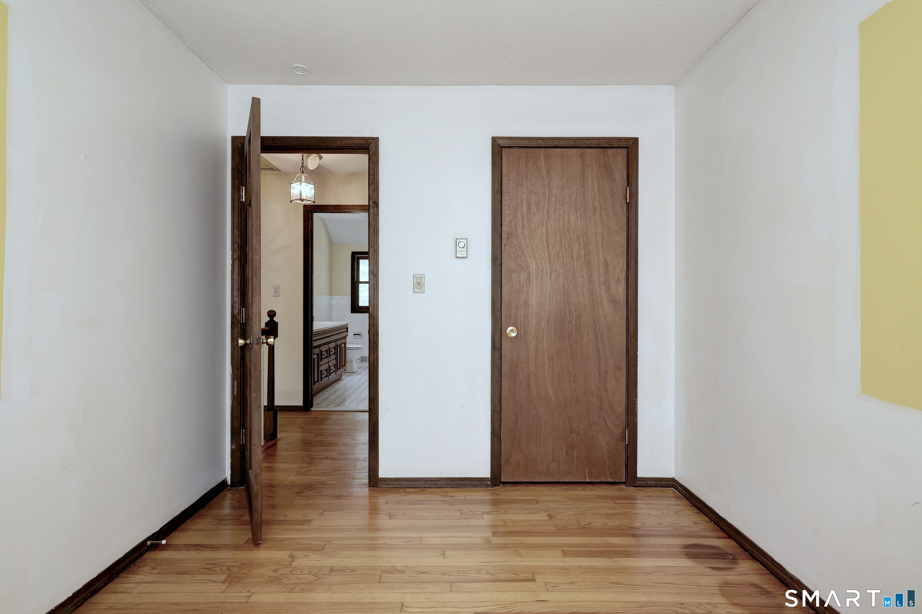 22 East Woods Road Roxbury, CT 06783 - Photo 28 of 37 a view of a hallway with wooden floor