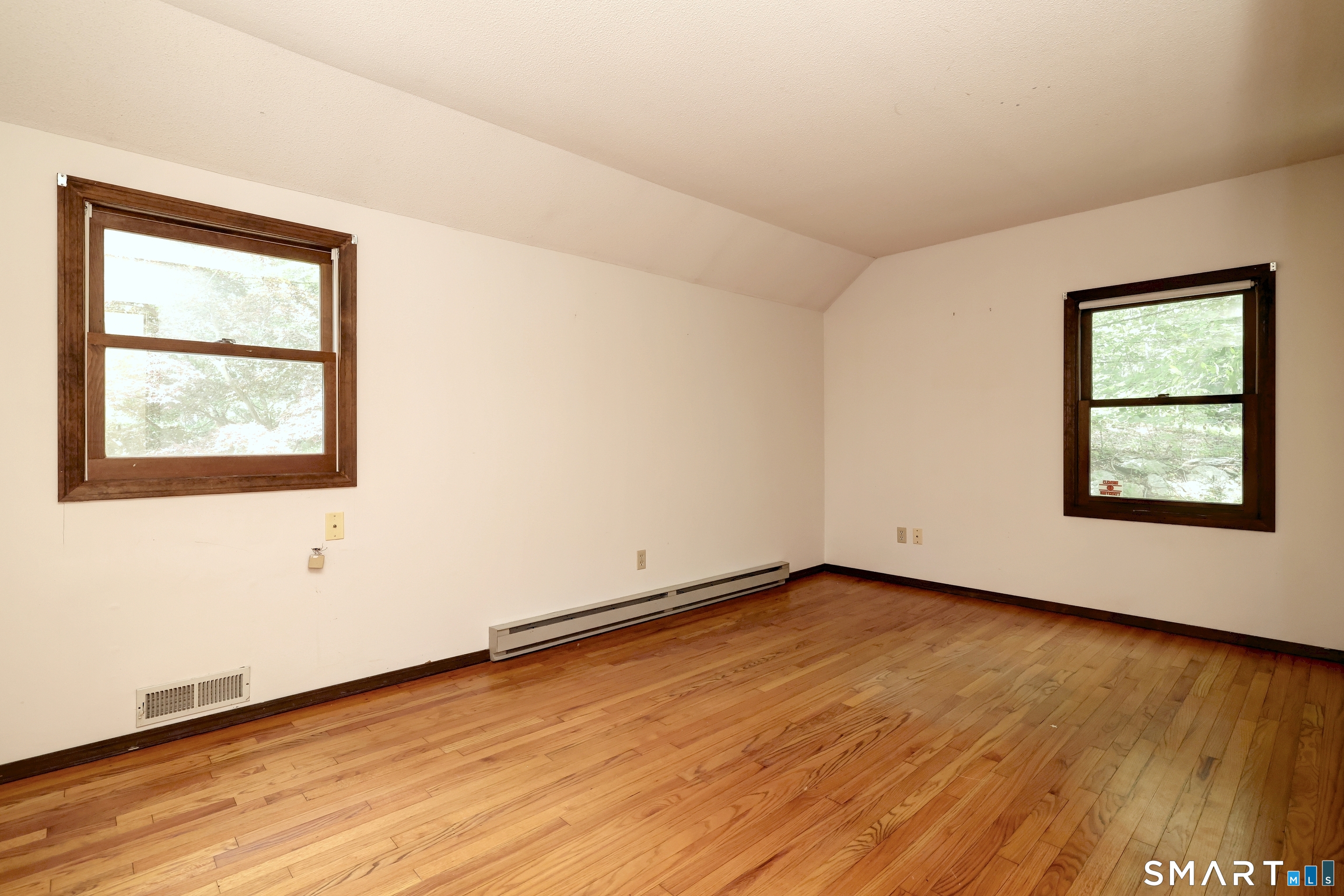 22 East Woods Road Roxbury, CT 06783 - Photo 29 of 37 an empty room with wooden floor and windows