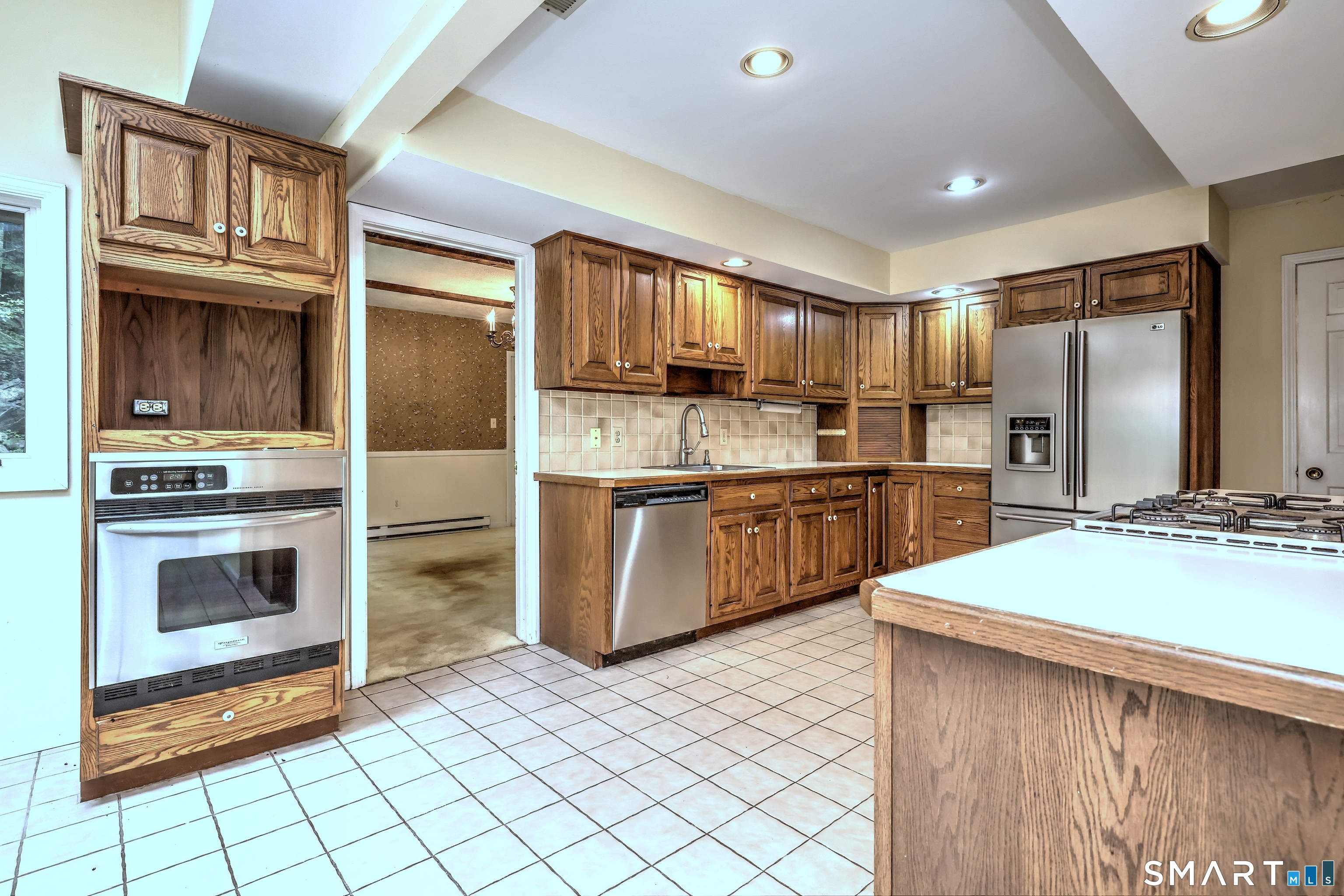 22 East Woods Road Roxbury, CT 06783 - Photo 5 of 37 a kitchen with stainless steel appliances a stove top oven and refrigerator