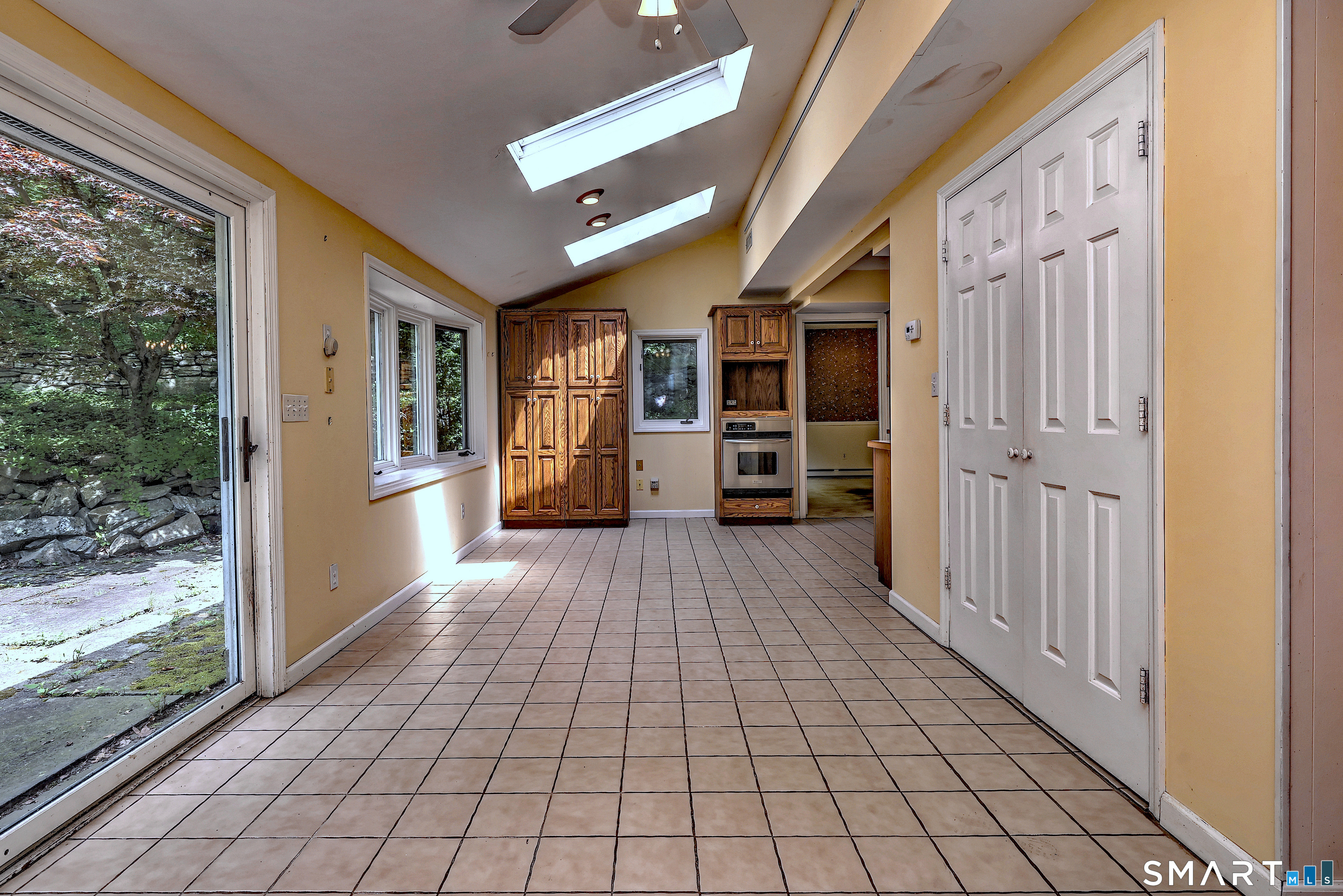 22 East Woods Road Roxbury, CT 06783 - Photo 9 of 37 a view of a porch with wooden floor and furniture