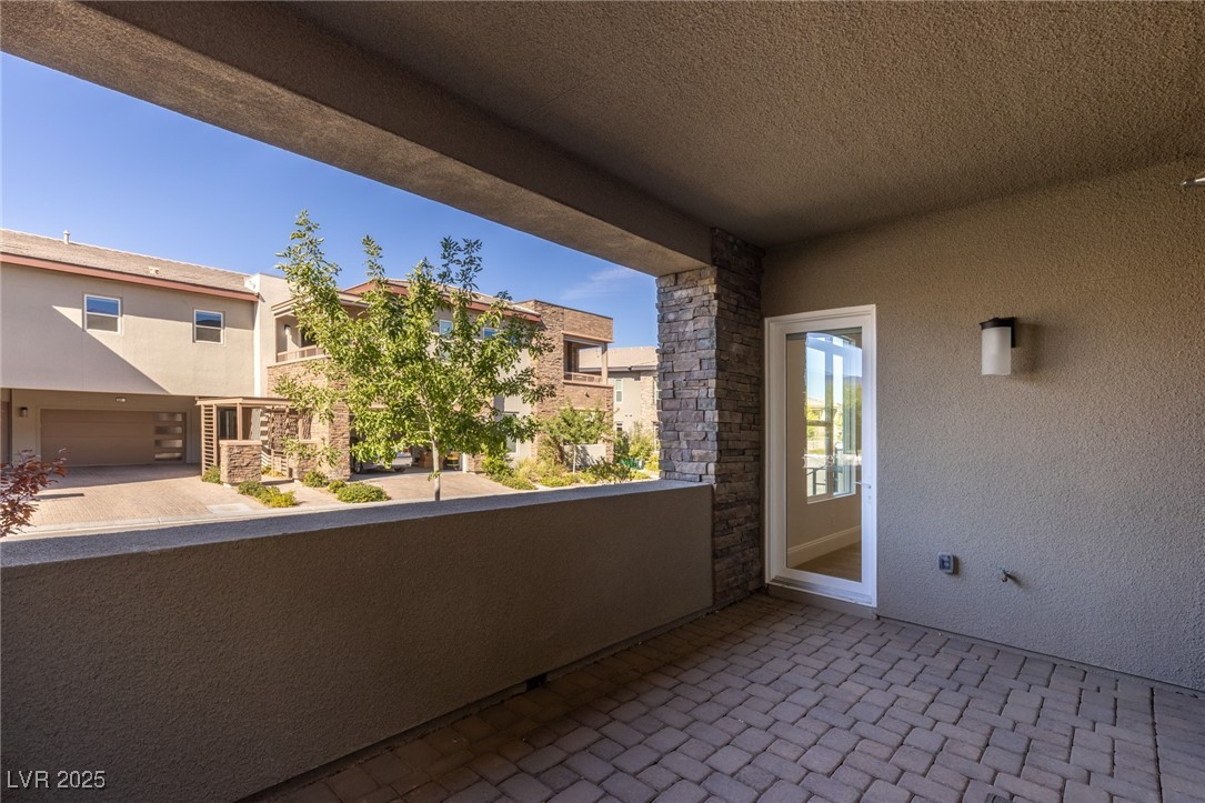 11280 Granite Ridge Drive, Unit 1075 Las Vegas, NV 89135 - Photo 48 of 82 Living Room / Primary Bedroom Patio
