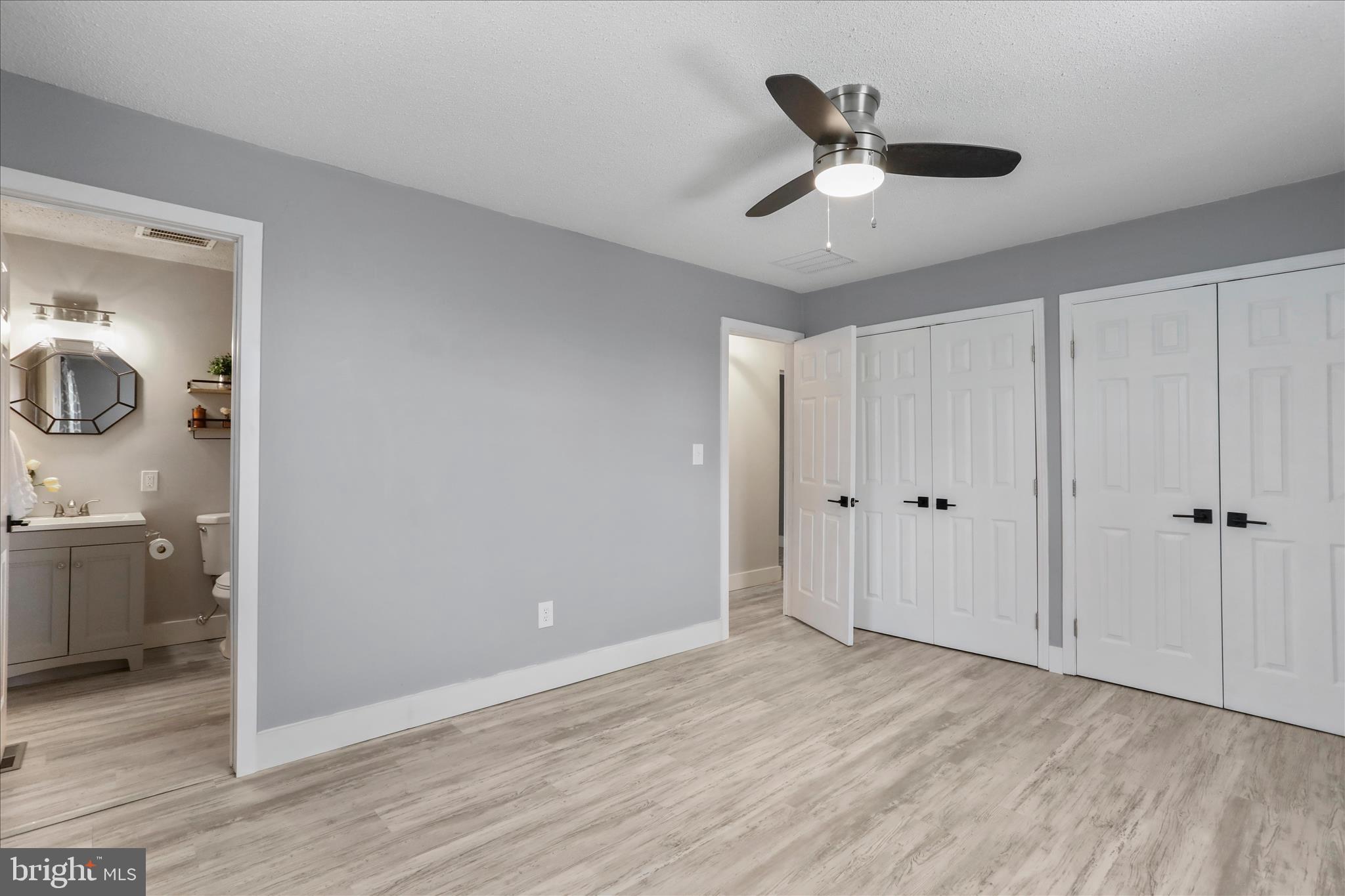 83 Dove Hill Drive Ranson, WV 25438 - Photo 30 of 71 a view of an empty room and wooden floor