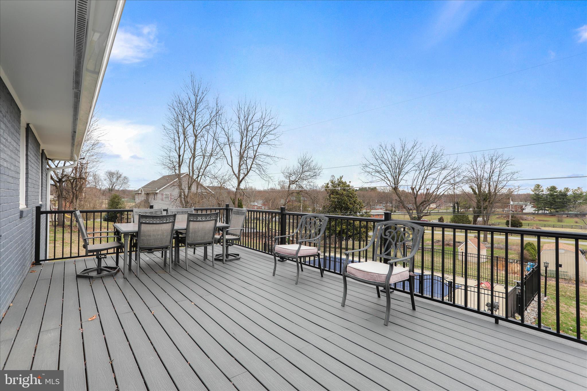 83 Dove Hill Drive Ranson, WV 25438 - Photo 3 of 71 a view of a roof deck with table and chairs a barbeque with wooden floor and fence