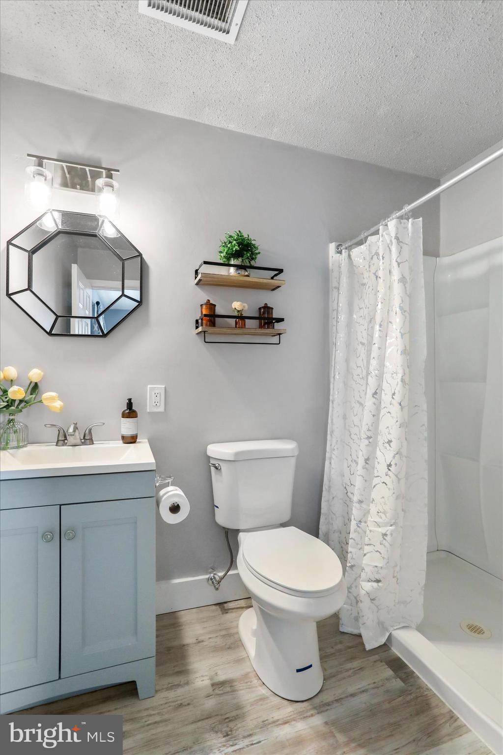 83 Dove Hill Drive Ranson, WV 25438 - Photo 31 of 71 a bathroom with a toilet a sink and a mirror